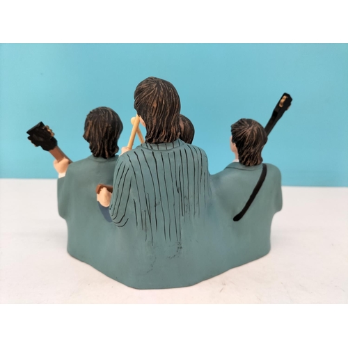 73 - Resin Figure of 'The Beatles'. 13cm High, 20cm x 9cm.
