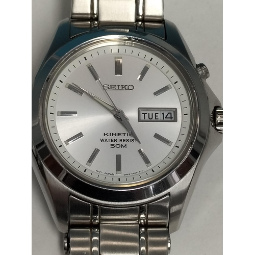 228 - Seiko Kinetic 50m Water Resistant. Model 5M63-OB90. Ticks and Stops. May Require Battery.