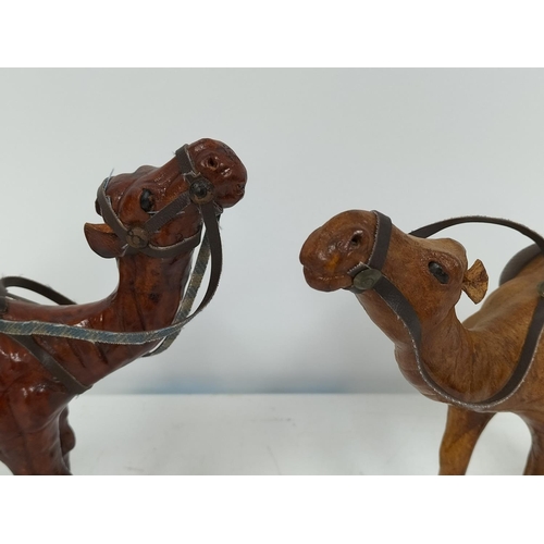 437 - Leather Camel Figures (2). 19cm High x 19cm.