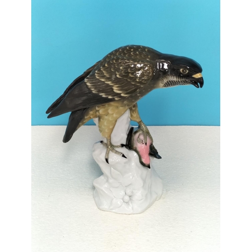 102 - Large Continental Porcelain Figure of a Peregrine Falcon. 24cm High, 23cm x 11cm. Restoration to Win... 