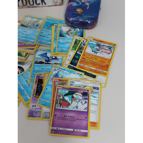 30 - Quantity of Pokemon Trading Cards in Pokemon Tin plus Tin Sign. 30cm x 20cm.
