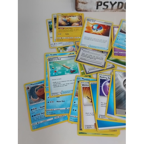 30 - Quantity of Pokemon Trading Cards in Pokemon Tin plus Tin Sign. 30cm x 20cm.