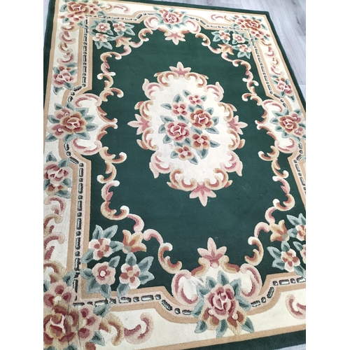 399 - Oriental Green and Cream Floral Rug. 228cm x 169cm. Collection Only.