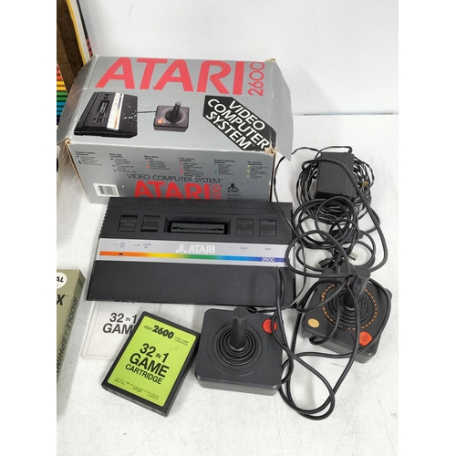 30A - ATARI 2600 Gaming System (Powers Up), Spectravideo Compumate Keyboard and a Wide Variety of Games to... 