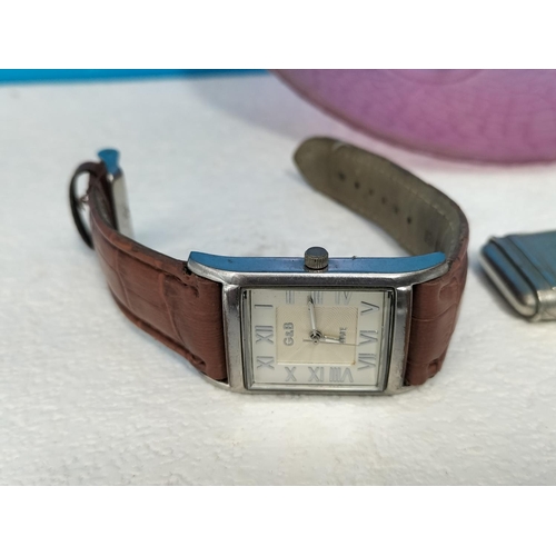 310 - Purple Glass Bowl with a Quantity of Watches for Spares/Repair. Bowl 6cm High, 20cm Diameter.