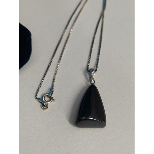 143 - Boxed Robinson's Whitby Jet Pendant on 18