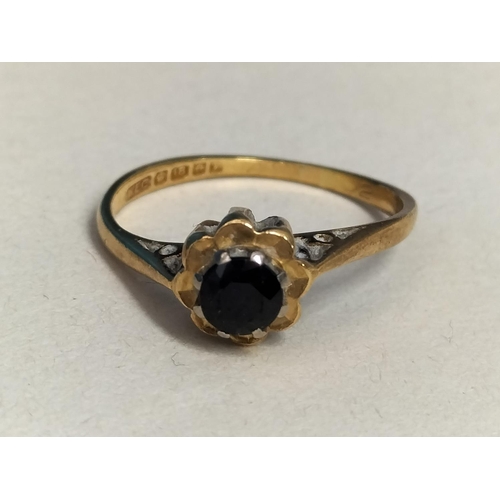 147 - 18ct Gold 750 and Dark Stone Ring. Size M. Total Weight 2.3 Grams.