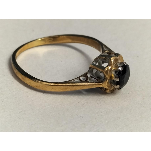 147 - 18ct Gold 750 and Dark Stone Ring. Size M. Total Weight 2.3 Grams.