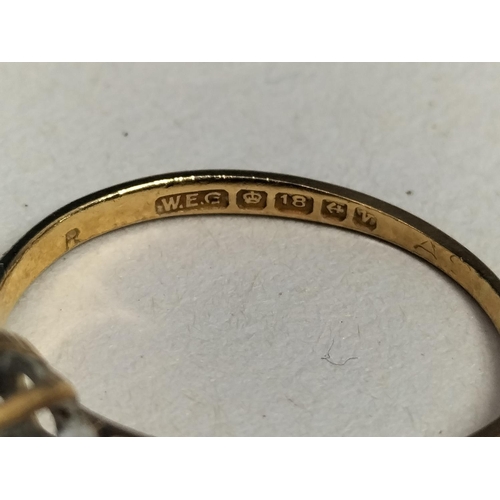 147 - 18ct Gold 750 and Dark Stone Ring. Size M. Total Weight 2.3 Grams.