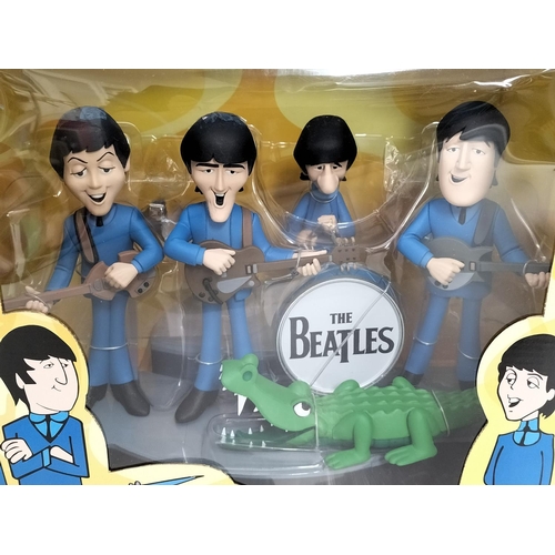 18 - The Beatles Mcfarlane toys The Beatles deluxe box set feature all 4 band members in their 1965 anima... 