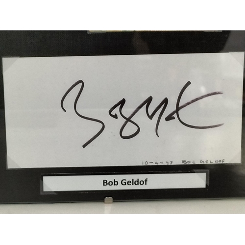 30 - Live Aid Framed display relating to the Live Aid Concert 13th July 1985 includes photo of Bob Geldof... 