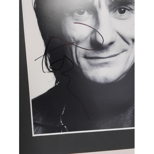 32 - Ronnie Wood signed Photograph mounted 30x26cm