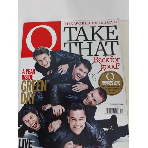 45 - Collection of music memorabilia to include signed examples, Eric Clapton tour program, Q magazine si... 