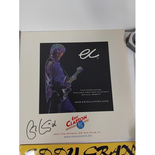 45 - Collection of music memorabilia to include signed examples, Eric Clapton tour program, Q magazine si... 