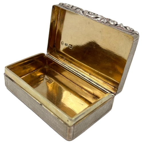 122 - A SILVER SNUFF BOX OF GOOD GAUGE WITH A HEAVILY WORKED THUMBPIECE, BIRMINGHAM, JOHN BETTRIDGE, 1825A... 