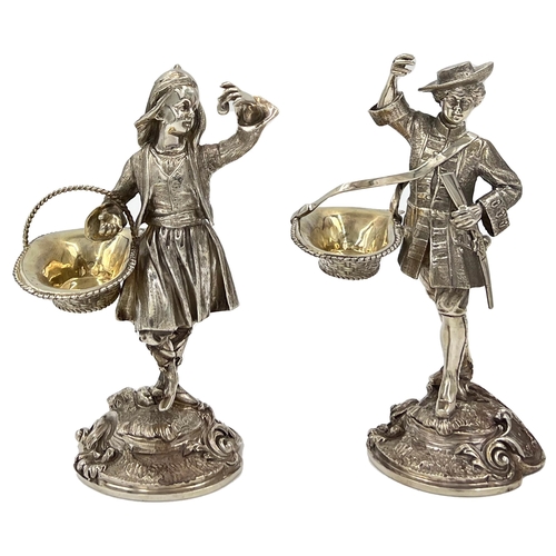 130 - A STUNNING PAIR OF SOILD SILVER FIGURES DEPICTIONG A GENTLEMAN AND A LADY CARRYING BASKETSA stunning... 