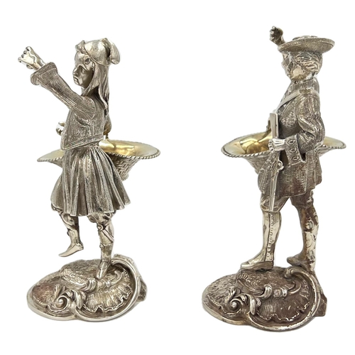 130 - A STUNNING PAIR OF SOILD SILVER FIGURES DEPICTIONG A GENTLEMAN AND A LADY CARRYING BASKETSA stunning... 