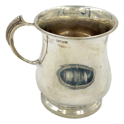 169 - A SMALL SILVER TANKARD OF BALUSTER FORM WITH AN UNUSUAL HANDLE,BIRMINGHAM, C BROS LTD, 1971A small s... 