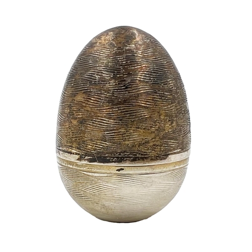 208 - A NICHOLAS PLUMMER SILVER SURPRISE EGG THAT OPENS TO REVEAL DAISIES, LONOND, NICHOLOS PLUMMER, 2004A... 