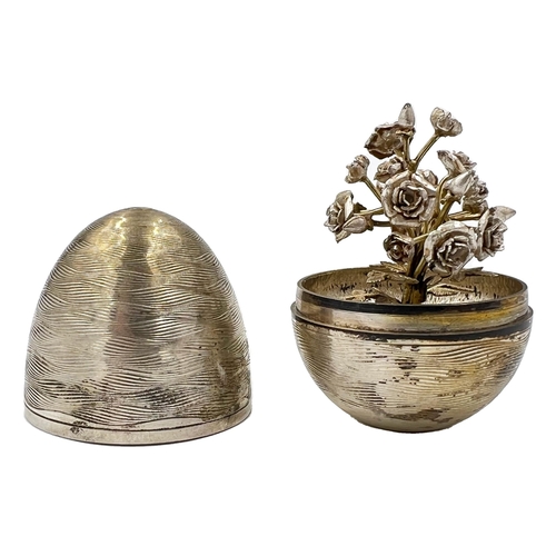 210 - A NICHOLAS PLUMMER SILVER SURPRISE EGG THAT OPENS TO REVEAL A ROSEBUSH, LONOND, 2003A Nicholas Plumm... 