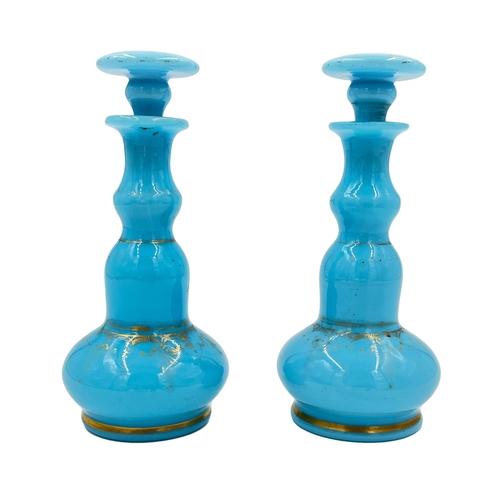 30 - PAIR OF OPALINE ELEGANCE – SKY BLUE OPALINE BOTTLESA pair of sky blue opaline bottles, adding a touc... 