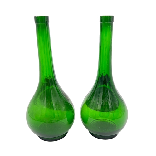 32 - GRACEFUL PAIR – GREEN GLASS BOTTLES/VASESA charming pair of green glass bottles, standing at 27.5cm.... 