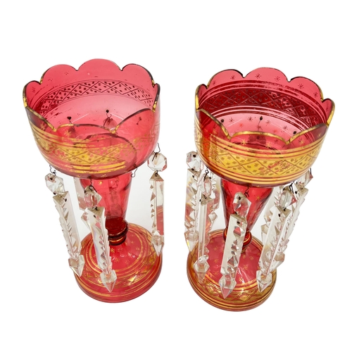 33 - PAIR OF RED GLASS LUSTRESA pair of exquisite red glass lustres, standing tall at 28cm, ready to illu... 