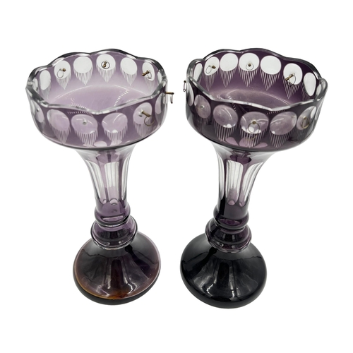 34 - PAIR OF PURPLE GLASS LUSTRESA pair of elegant purple glass lustres, adding a regal touch with a heig... 