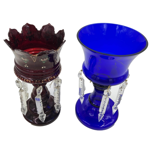 35 - RUBY AND BLUE GLASS LUSTRESA fine lustres in ruby and blue glass, both standing gracefully at 25.5cm... 