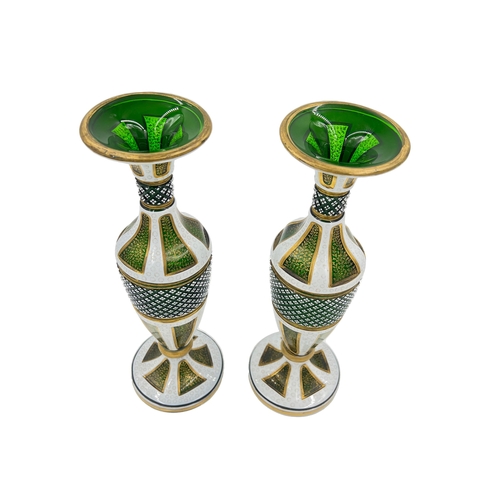 46 - PAIR OF BOHEMIAN GLASS VASES, LATE 19TH CENTURYA delightful pair of green Bohemian glass vases stand... 