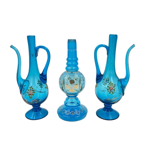 49 - BLUE SERENITY: BOHEMIAN GLASS EWER AND VASE SETThis set includes a serene blue Bohemian glass ewer (... 