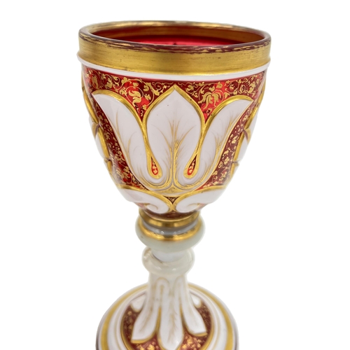 5 - FLORAL RADIANCE – HAND-PAINTED BOHEMIAN RUBY GLASS VASE AND GOBLETS, 19TH CENTURYLate 19th-century r... 