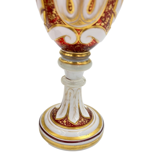 5 - FLORAL RADIANCE – HAND-PAINTED BOHEMIAN RUBY GLASS VASE AND GOBLETS, 19TH CENTURYLate 19th-century r... 