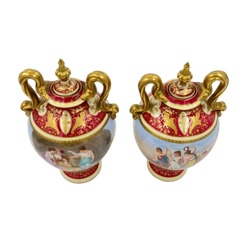 52 - VIENNA CHARM: ELEGANT PAIR OF PORCELAIN VASESA charming pair of Vienna vases standing at 23cm, showc... 