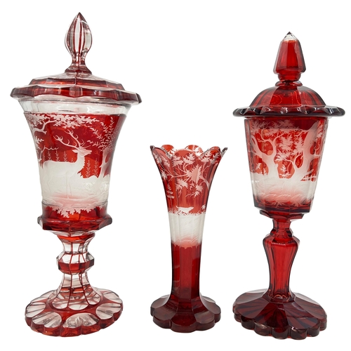 54 - BOHEMIAN RUBY-STAINED GLASS GOBLET TRIOTwo lided Bohemian red-stained glass goblet and vas... 