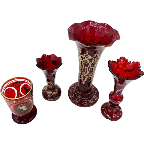 55 - RUBY SYMPHONY: GROUP OF BOHEMIAN GLASS VASES AND CUPA symphony of red/ruby in this group of Bohemian... 