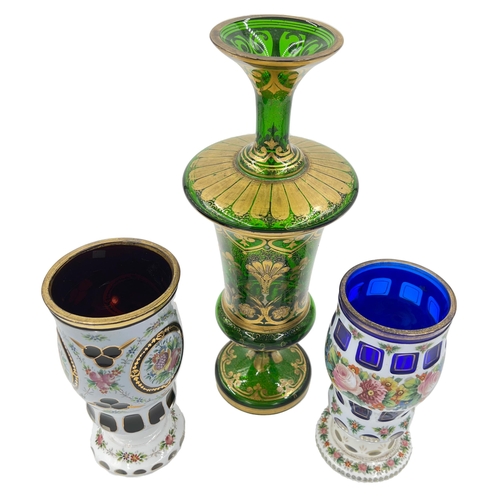 59 - FLORAL TRIO: BOHEMIAN GLASS CUPS AND VASE ENSEMBLEEmbrace the charm of florals with this trio of Boh... 