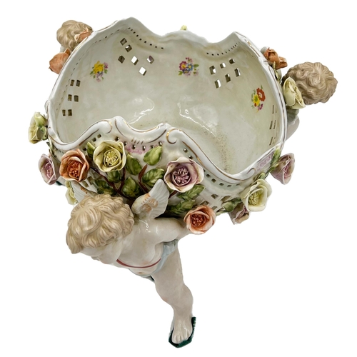 61 - GERMAN PORCELAIN BOWL CARRIED BY THREE FIGURES AND ADORNED WITH EXQUISITE FLORAL DECORATIONSGerman p... 