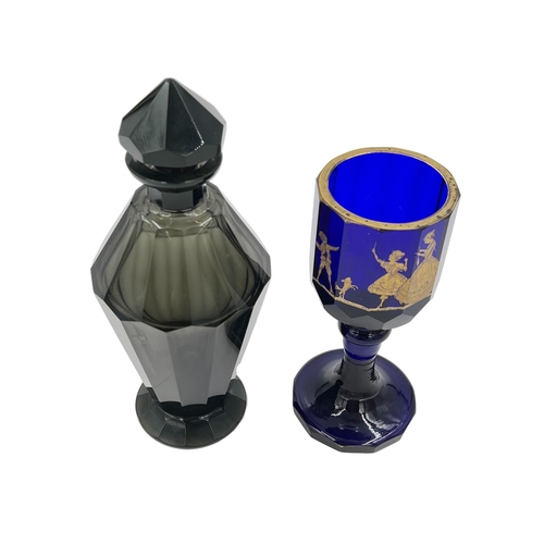 62 - BLACK BOHEMIAN GLASS VASE AND BLUE GOBLET Featuring a black Bohemian glass vase (28cm) and a bl... 