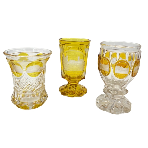 7 - CLASSIC AMBER APPEAL – THREE 19TH CENTURY BOHEMIAN AMBER AND CLEAR GLASS GOBLETSTrio of 19th-century... 