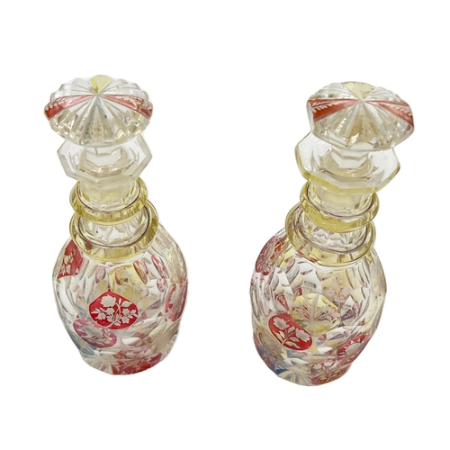 72 - PAIR OF BOHEMIAN GLASS PERFUME BOTTLESA charming duo of Bohemian glass perfume bottles, standing at ... 