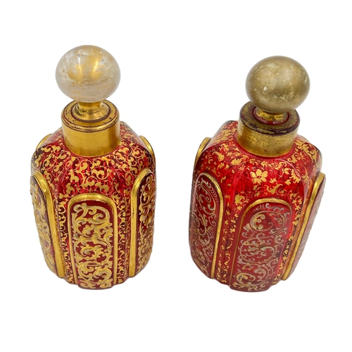 73 - PAIR OF RUBY BOHEMIAN GLASS PERFUME BOTTLESPair of Ruby and old gilded Bohemian Glass Perfume Bottle... 