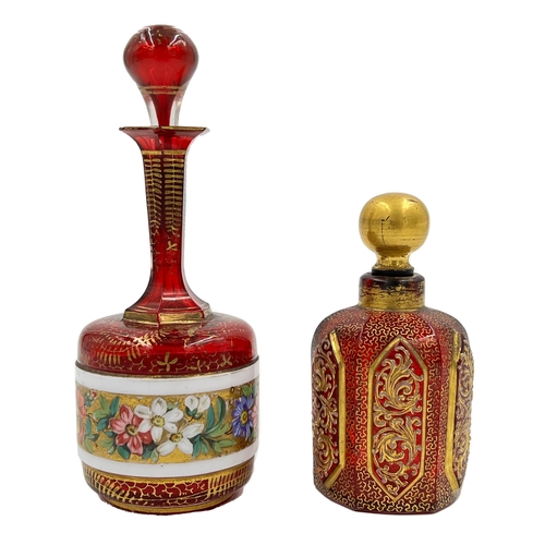 77 - TWO BOHEMIAN RED GLASS PERFUME BOTTLESTwo exquisite Bohemian red glass perfume bottles, standing at ... 