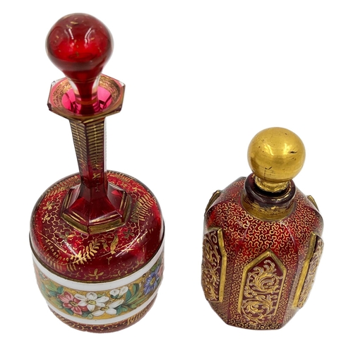 77 - TWO BOHEMIAN RED GLASS PERFUME BOTTLESTwo exquisite Bohemian red glass perfume bottles, standing at ... 