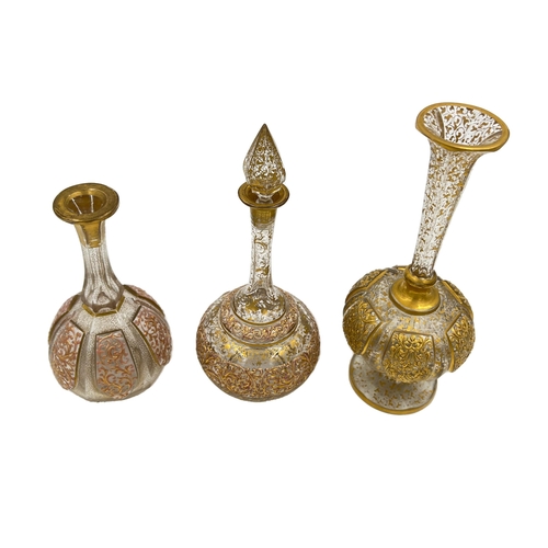 78 - SET OF BOHEMIAN GLASS VASES AND BOTTLE A charming set comprising two Bohemian glass vases and a bott... 