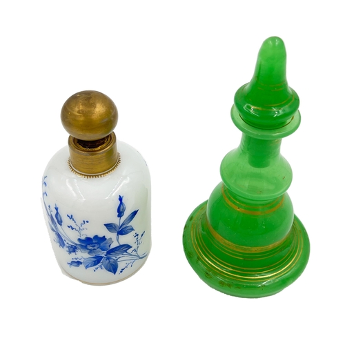 79 - TWO OPALINE GLASS PERFUME BOTTLESOpaline glass perfume bottles, standing at 17.5cm and 13cm tall.... 