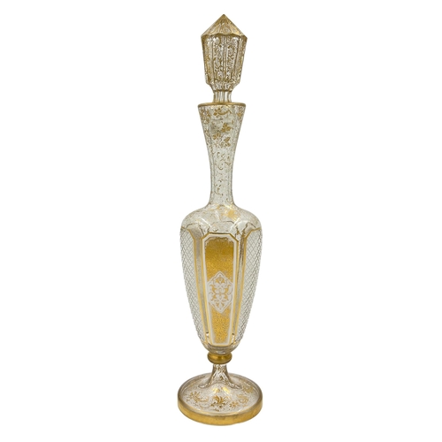 87 - LARGE BOHEMIAN GLASS BOTTLE WITH LIDA grand Bohemian glass bottle adorned with lavish gold gilding a... 