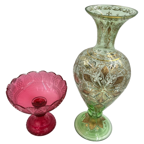 88 - RUBY BOHEMIAN GLASS TAZZA AND LARGE GREEN GLASS VASERuby Bohemian glass tazza and a large green glas... 