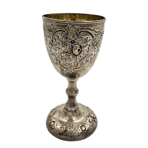 148 - A VICTORIAN SILVER GOBLET WITH EMBOSSED DECORATION AND AN AGRICULTURAL RELATED INSCRIPTION, BH, 1869... 