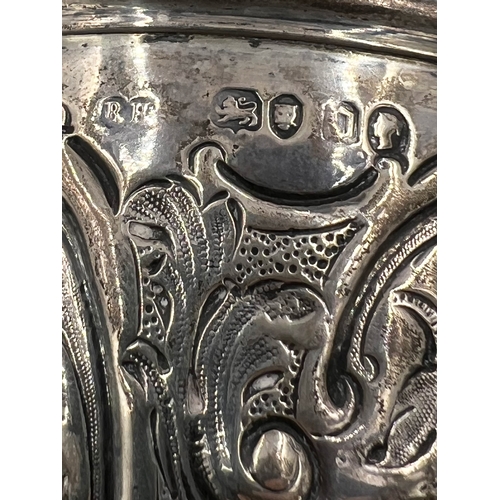 148 - A VICTORIAN SILVER GOBLET WITH EMBOSSED DECORATION AND AN AGRICULTURAL RELATED INSCRIPTION, BH, 1869... 